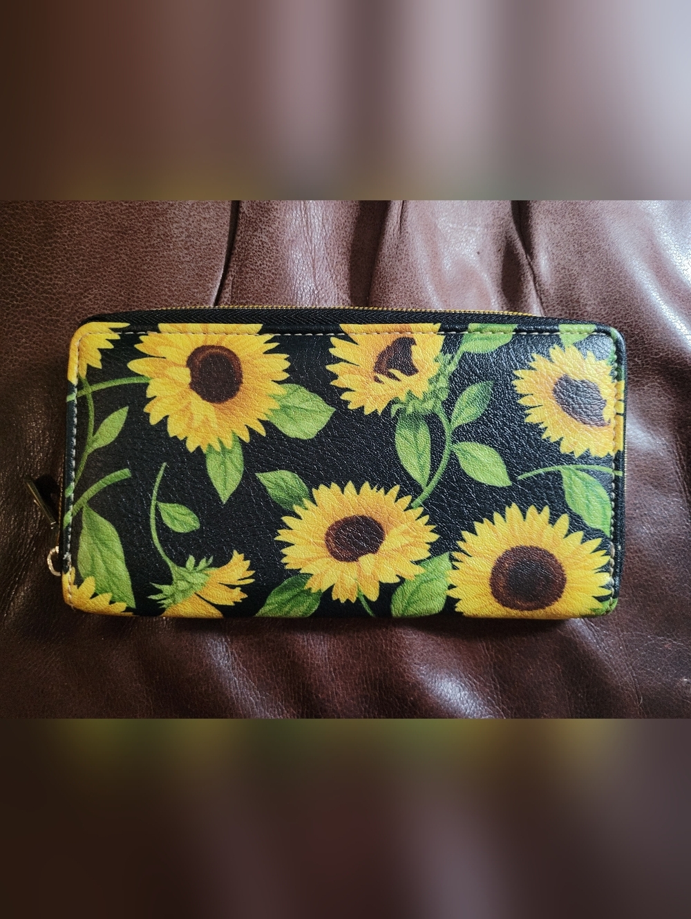 Black and yellow sunflower print wallet with zipper closure